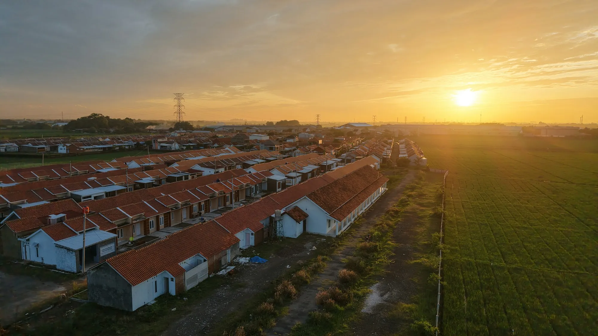 Aerial view of a new housing development at sunset